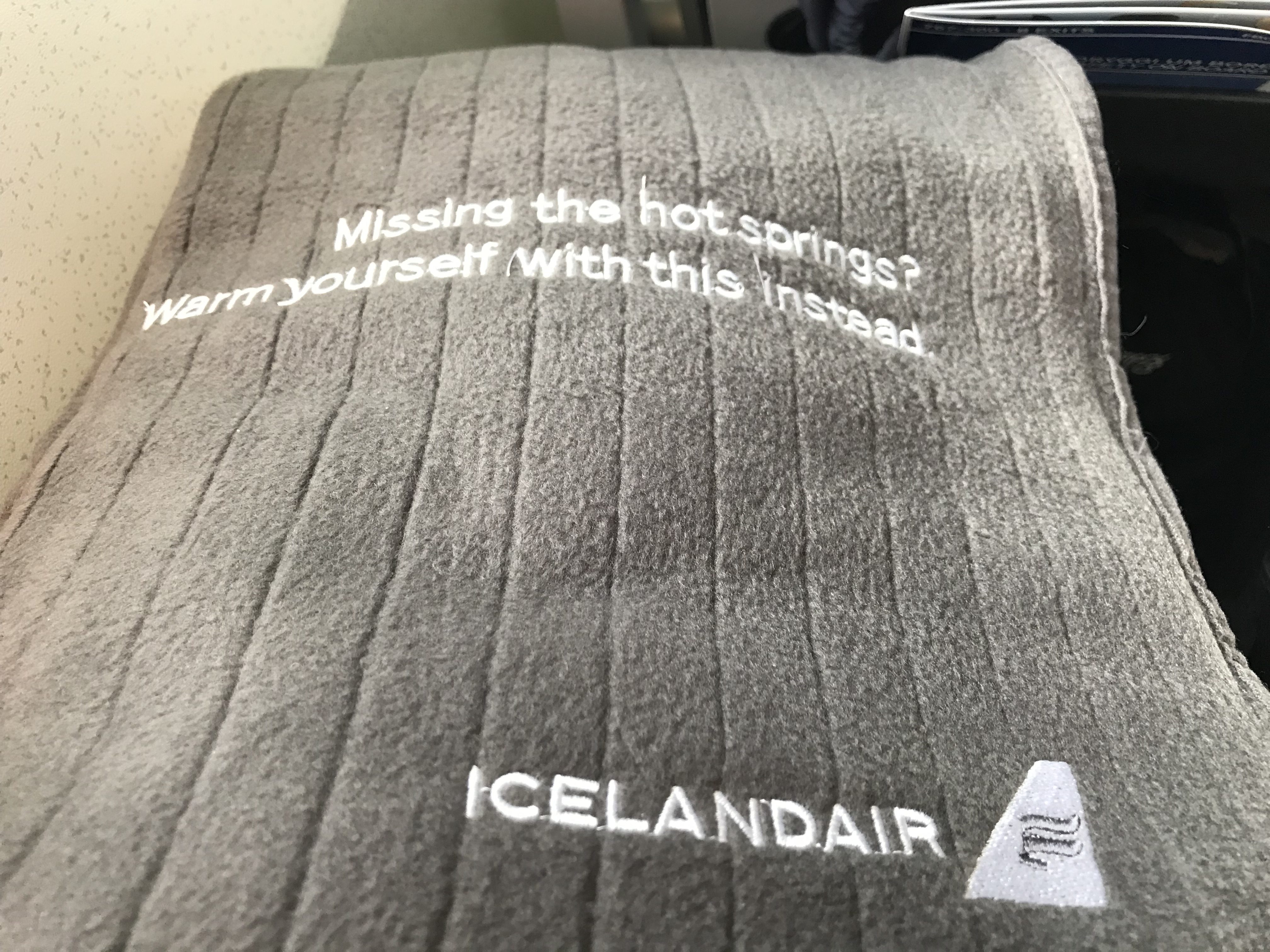a grey towel with white text