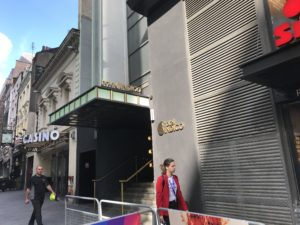 a woman walking in front of a building