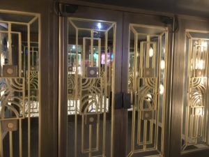 a row of doors with gold designs