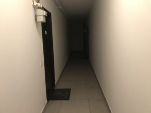 a hallway with a door and a door