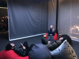 a group of people sitting in bean bags