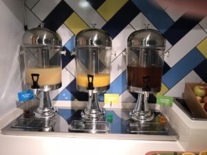 a group of juice dispensers