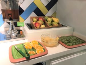 a trays of fruit and a bowl of fruit