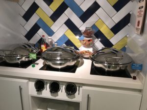 a kitchen with pots on top of stove