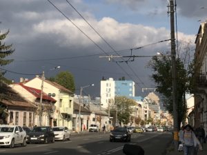 a street with cars and buildings on the side