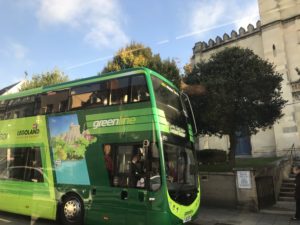 a green double decker bus