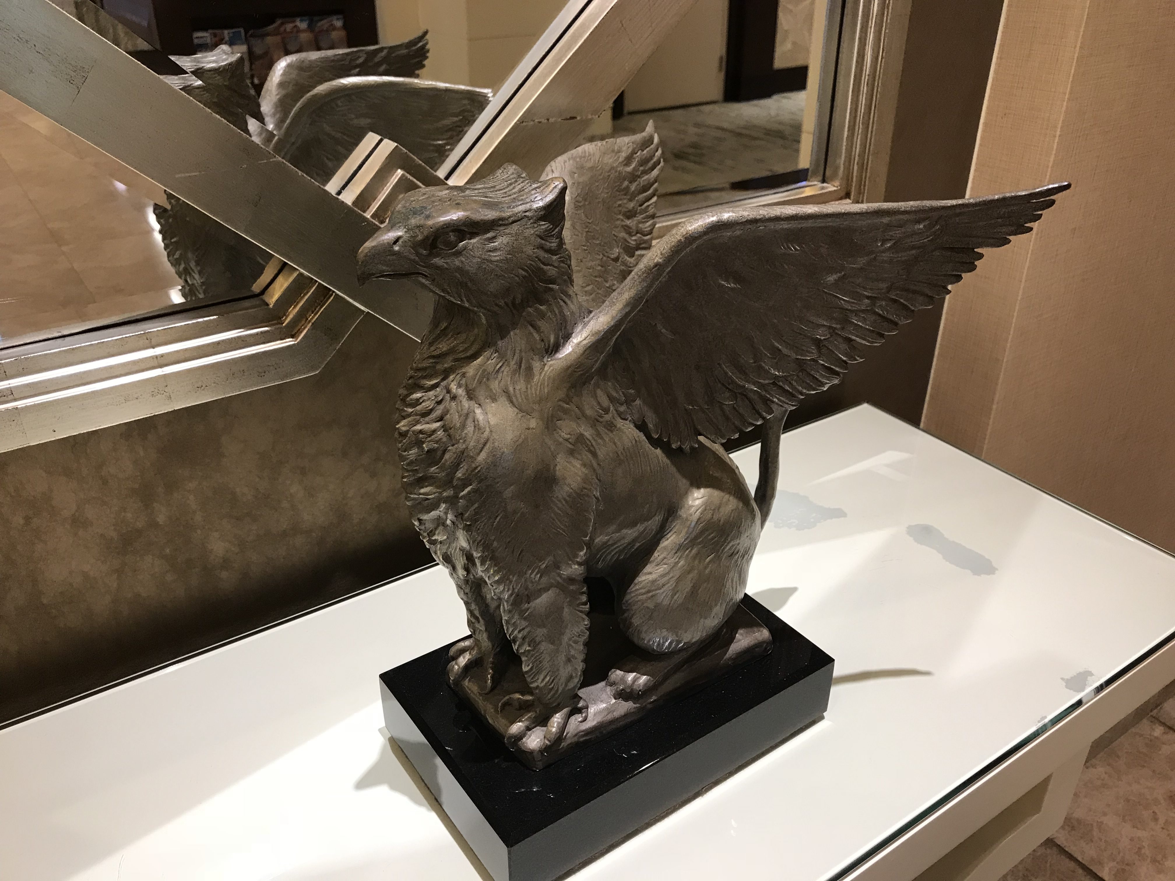 a statue of a griffin on a table