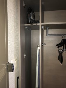 a closet with a black bag and swingers