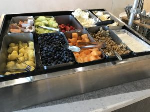 a tray of fruit and cereals