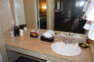 a bathroom sink with a tissue box