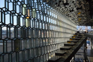 a close-up of a glass wall with Harpa in the background