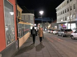 people walking on a sidewalk