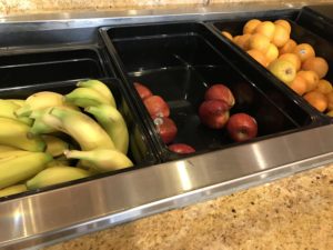 a trays of fruit in a row