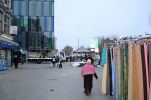 a woman walking down a street