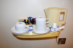 a tray with coffee cups and saucers