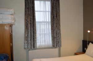 a window with curtains in a room