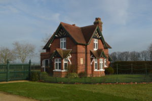 a brick house with a fence