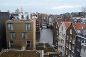 a view of a river between buildings