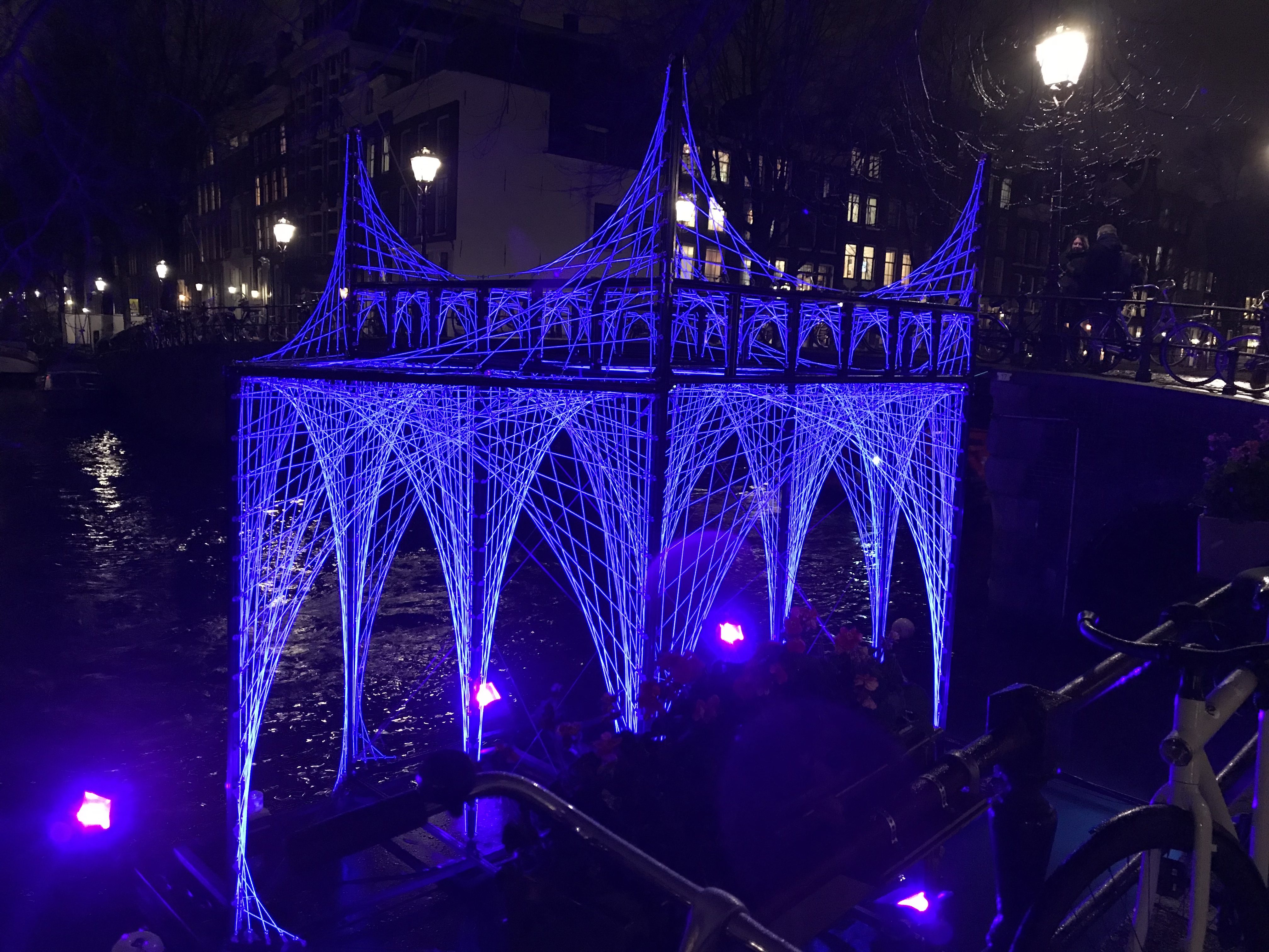 a structure with purple lights on it