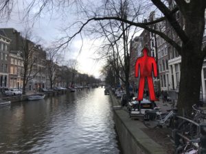 a body of water with a red man