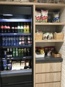 a shelf with drinks and snacks