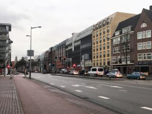 a street with cars and buildings