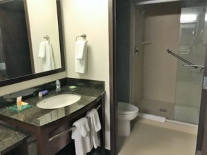 a bathroom with a mirror and sink