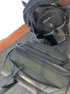 a black backpack next to a black backpack