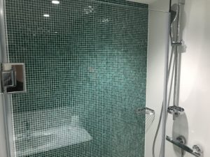a shower with a glass wall