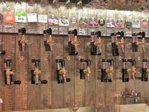 a row of beer taps