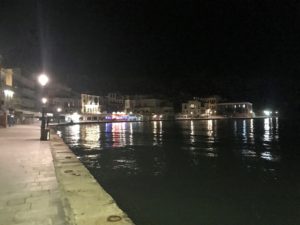 a body of water with buildings in the background