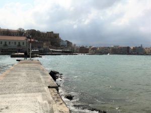 a body of water with buildings in the background