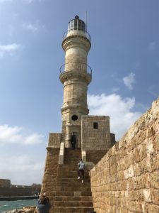 a stone tower with a light tower