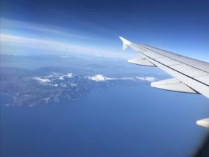 an airplane wing above the water