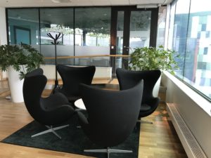 a group of black chairs in a room