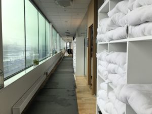 a long hallway with white towels