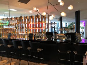 a bar with chairs and a counter