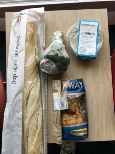 a baguette and other food items on a table