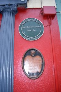 a plaque on a red wall