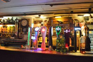 a bar with different colored taps