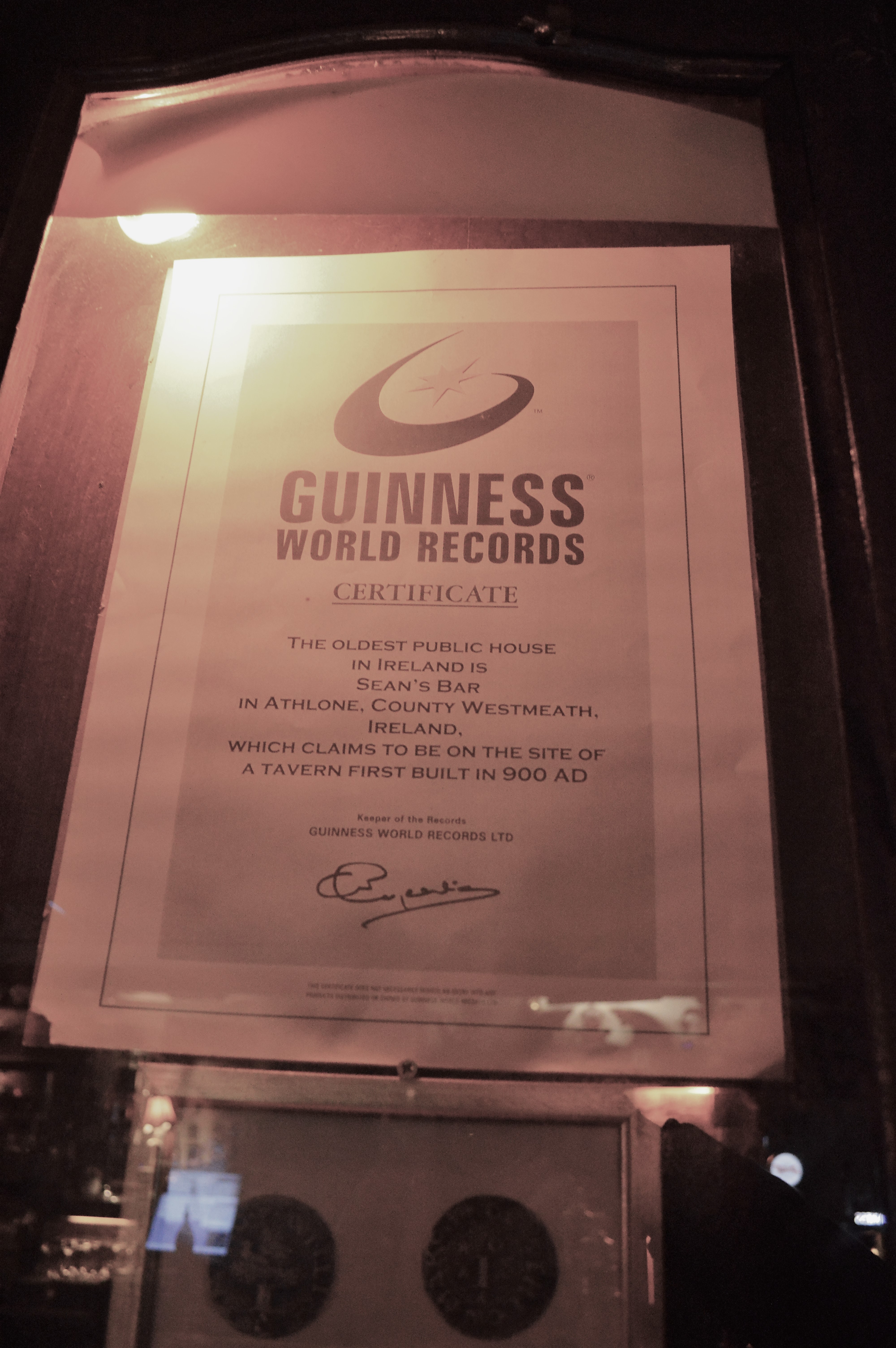 a certificate in a glass case