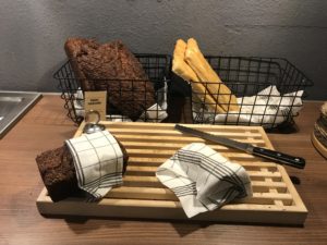 bread and bread on a wooden board