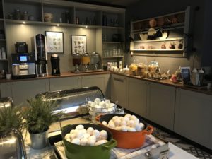 a kitchen with a counter top and a variety of bowls of food