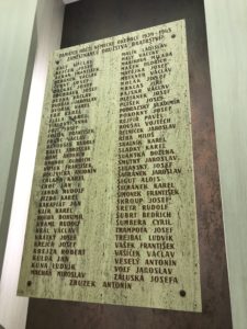 a stone plaque with names