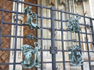 a gate with statues on it