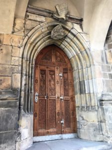 a wooden door in a stone building