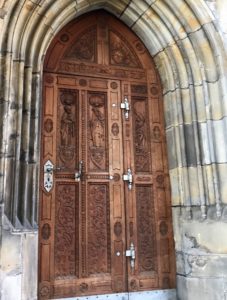 a wooden door with a stone arch