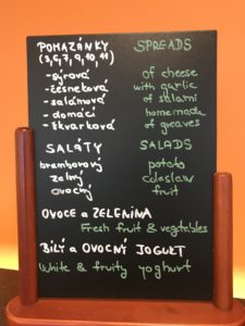 a menu board with writing on it