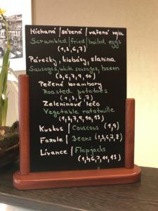 a menu board with white writing on it