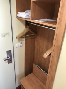 a closet with shelves and swingers